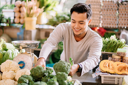 A man picking vegetables