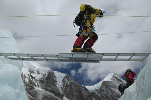 Horacio Galanti crossing a crevasse in the Khumbu Icefall