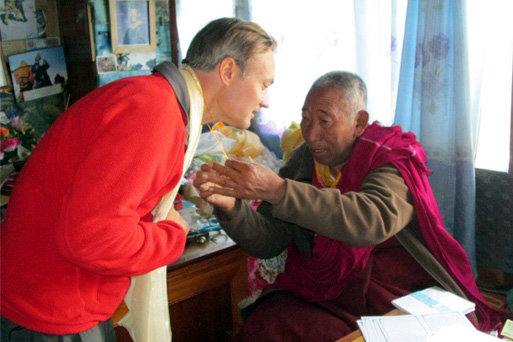 Horacio Galanti is blessed by a monk