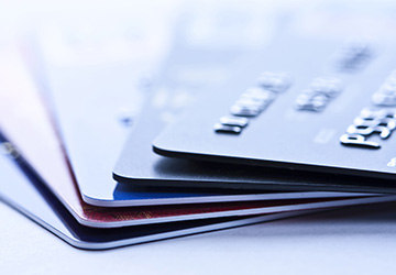 a stack of credit cards, in cold color tone.