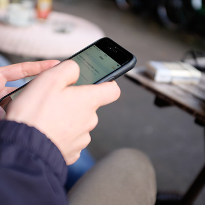 A hand is using mobile