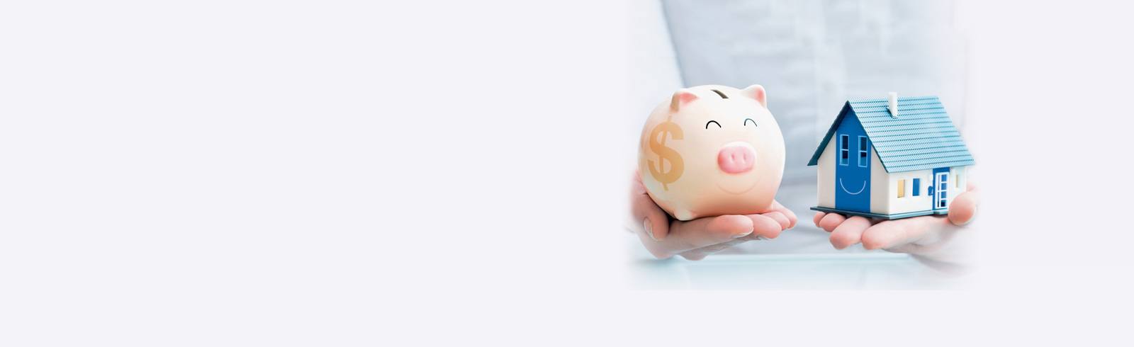 hands holding a piggy bank and a house model