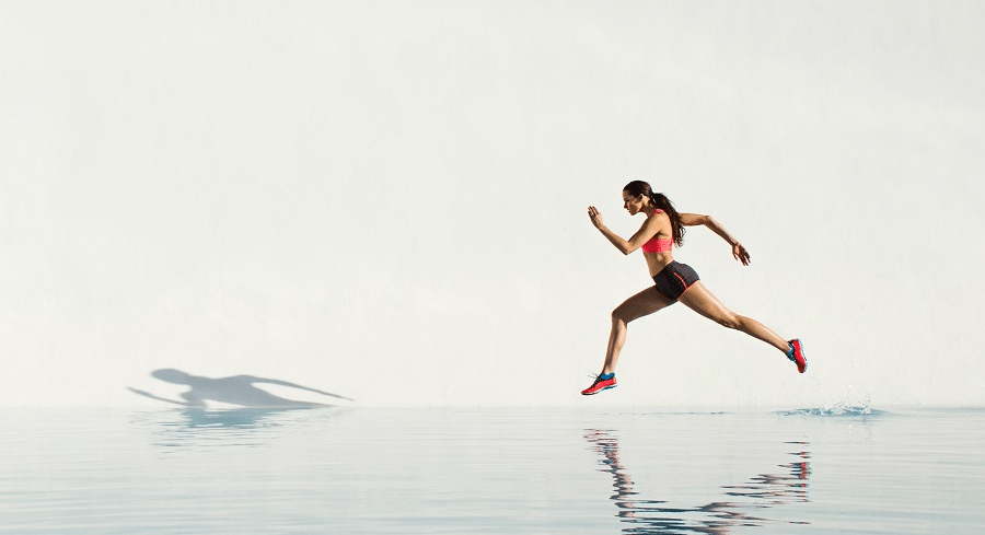 Sg speed run woman water blue sky snow