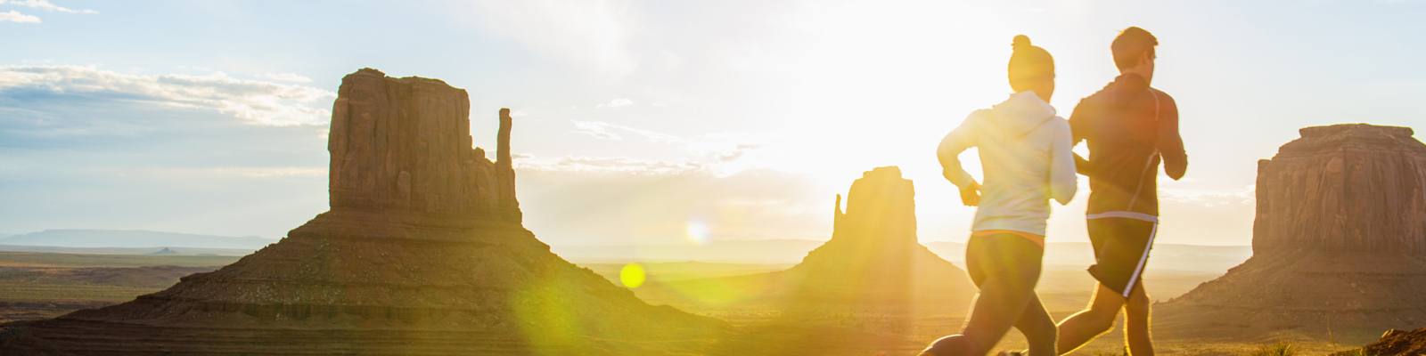 Px photo id caucasian couple running in monument valley utah united states