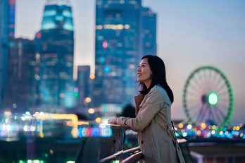Person in front of cityscape 