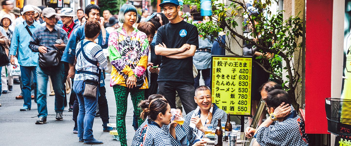 restaurant spilling out onto busy street