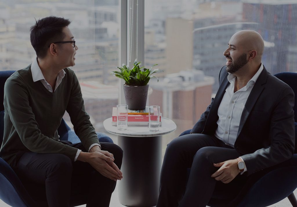 Raheel and Adrian sat down talking