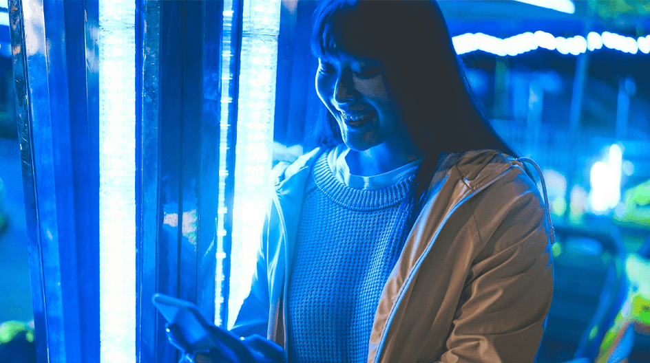 Asian girl looking at mobile phone
