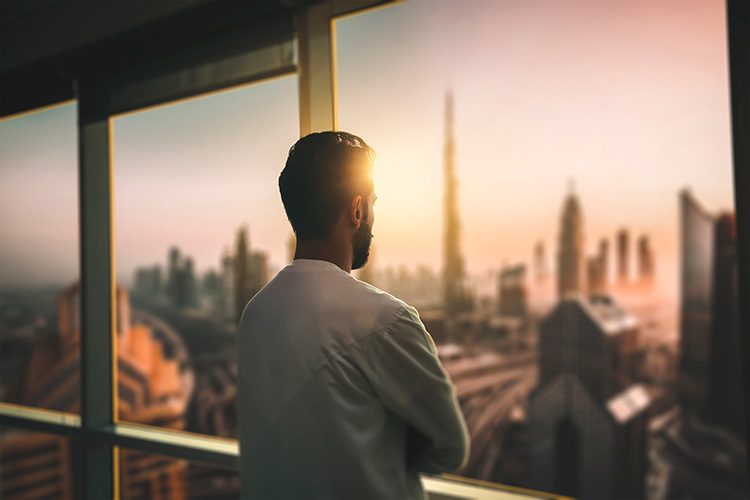 A man looks over the Dubai skyline