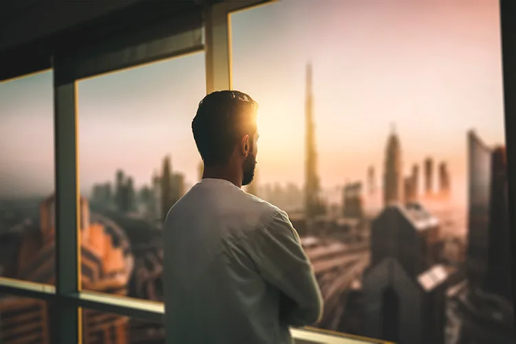 A man looks over the Dubai skyline