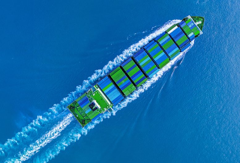 A ship transporting blue and green containers.