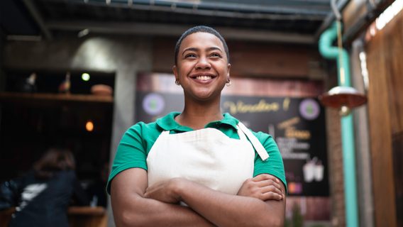 A woman works in a cafe.