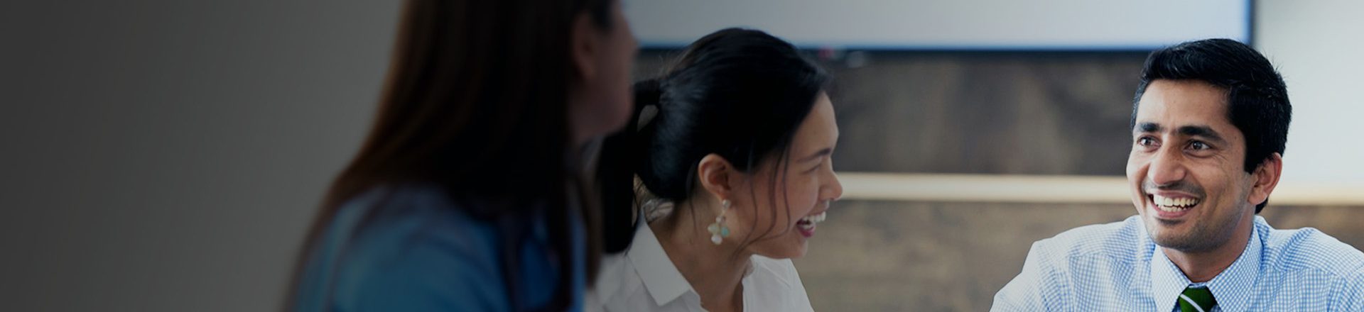 people in office discussing