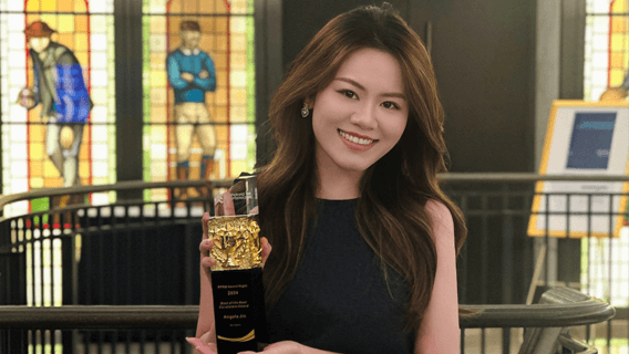 Angela holding an award