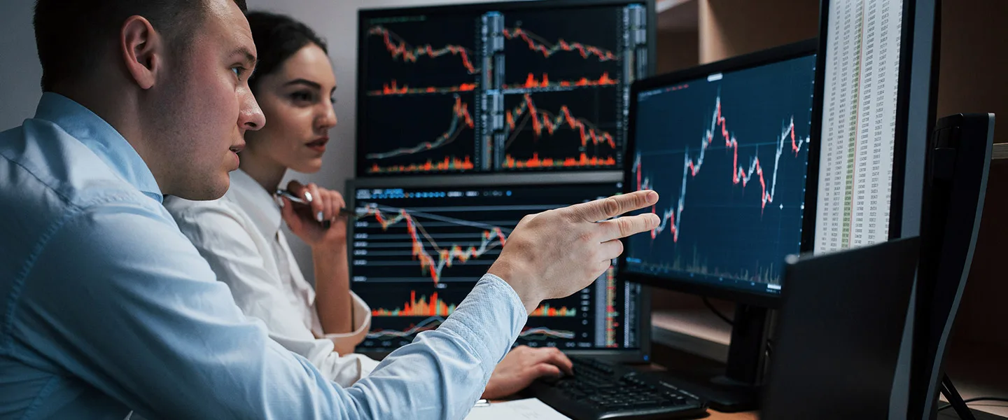 Two people monitoring investements