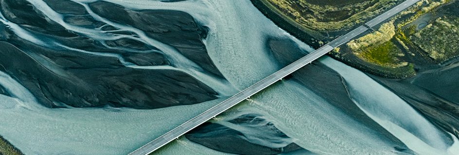 A bridge over a river with marbled waters