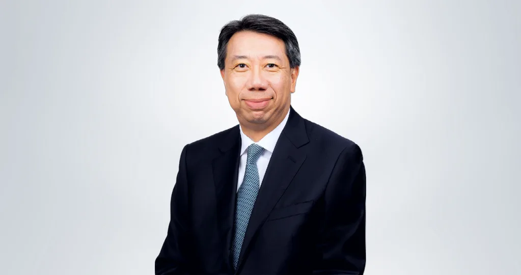 A portrait of Ben Hung in a suit