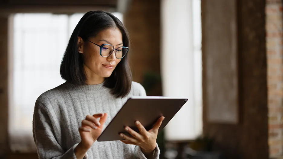A woman looking into a tab