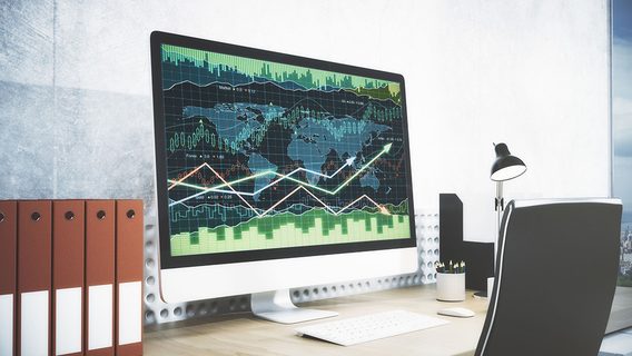 Modern workplace with forex chart on computer screen