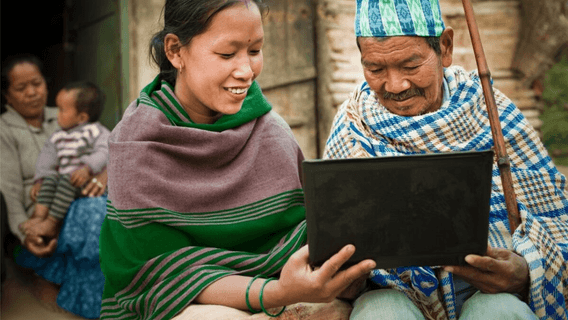 Two people in Vietnam using laptop
