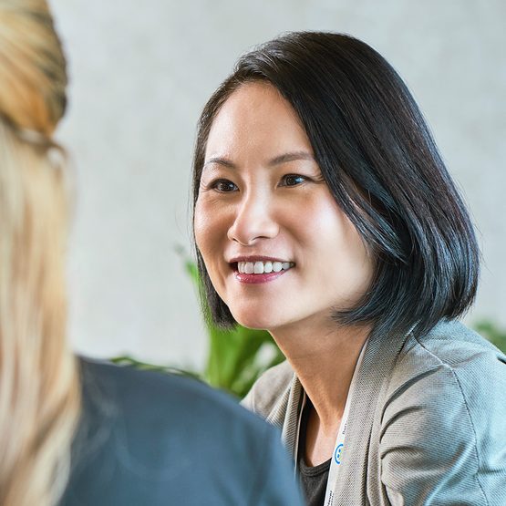 Smiling asian woman in a meeting