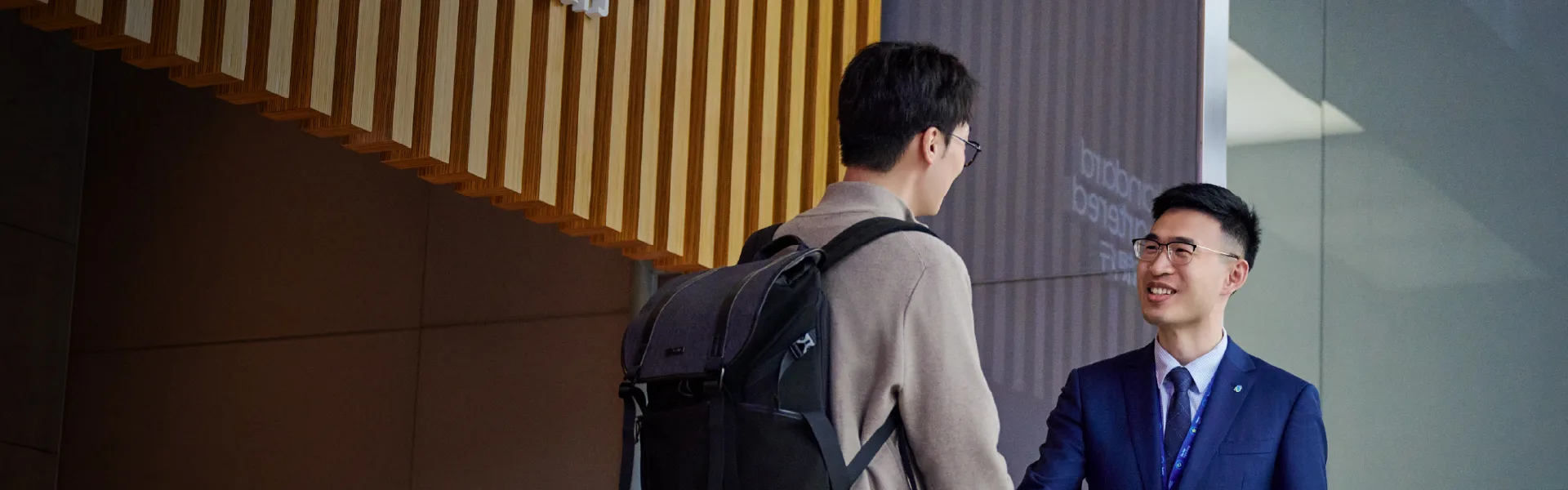 Two men talking at their workplace