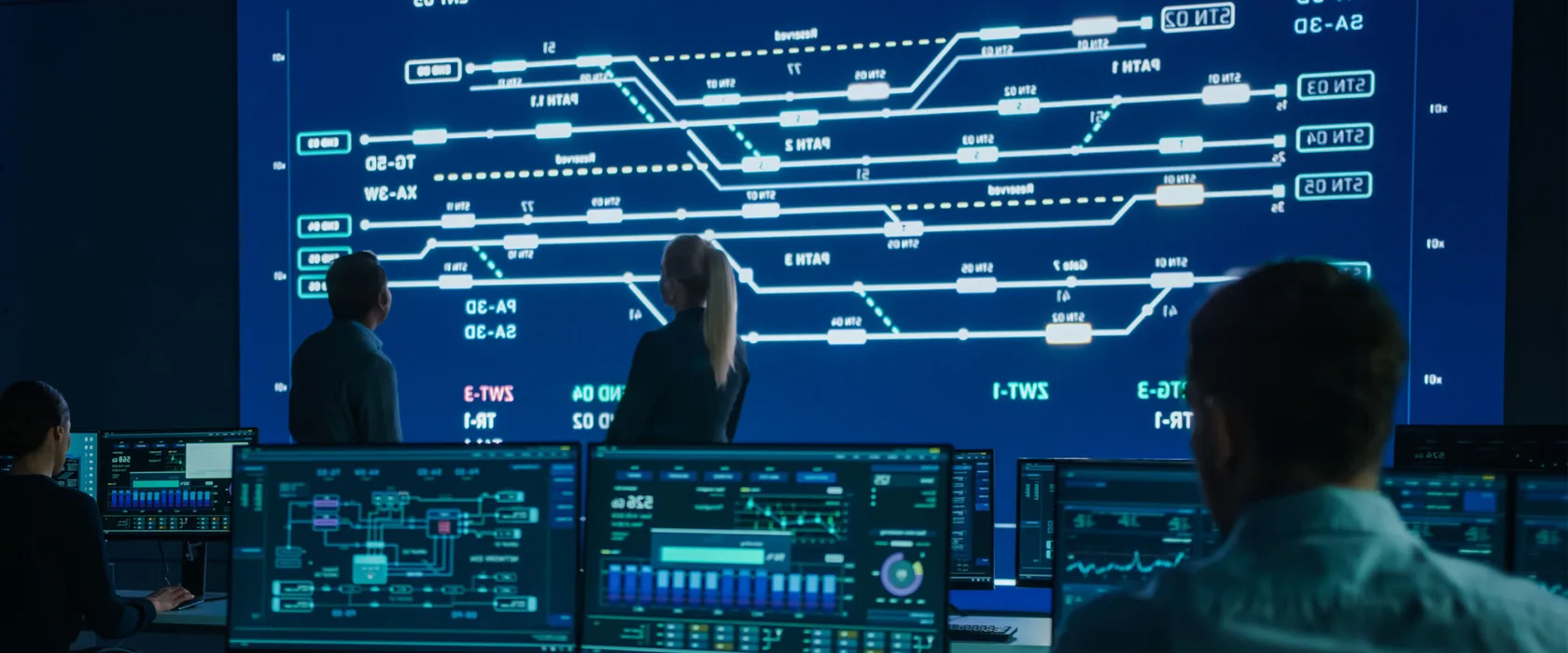 Computer engineers work on a public transport system.