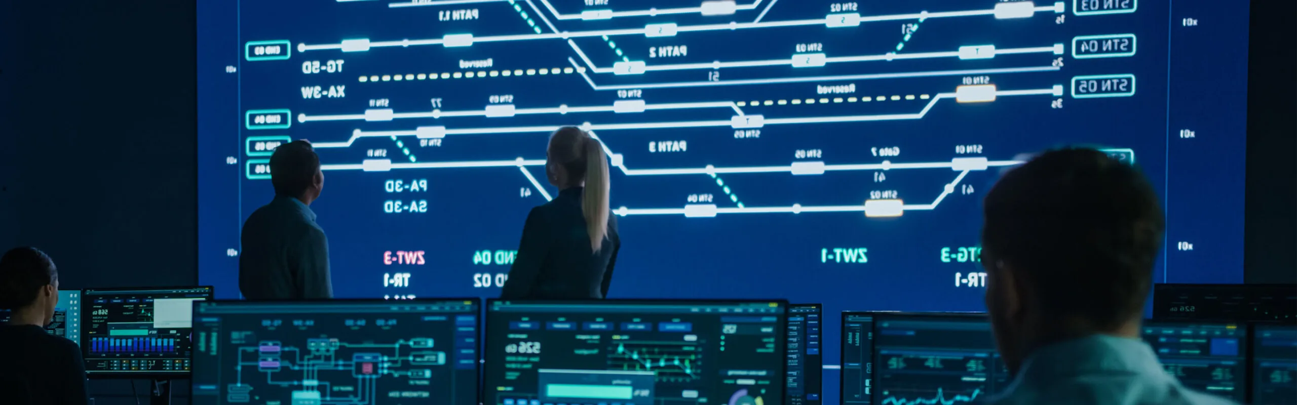 Computer engineers work on a public transport system.