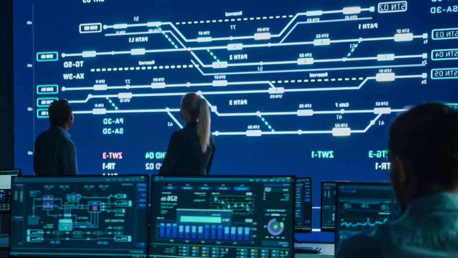 Computer engineers work on a public transport system.