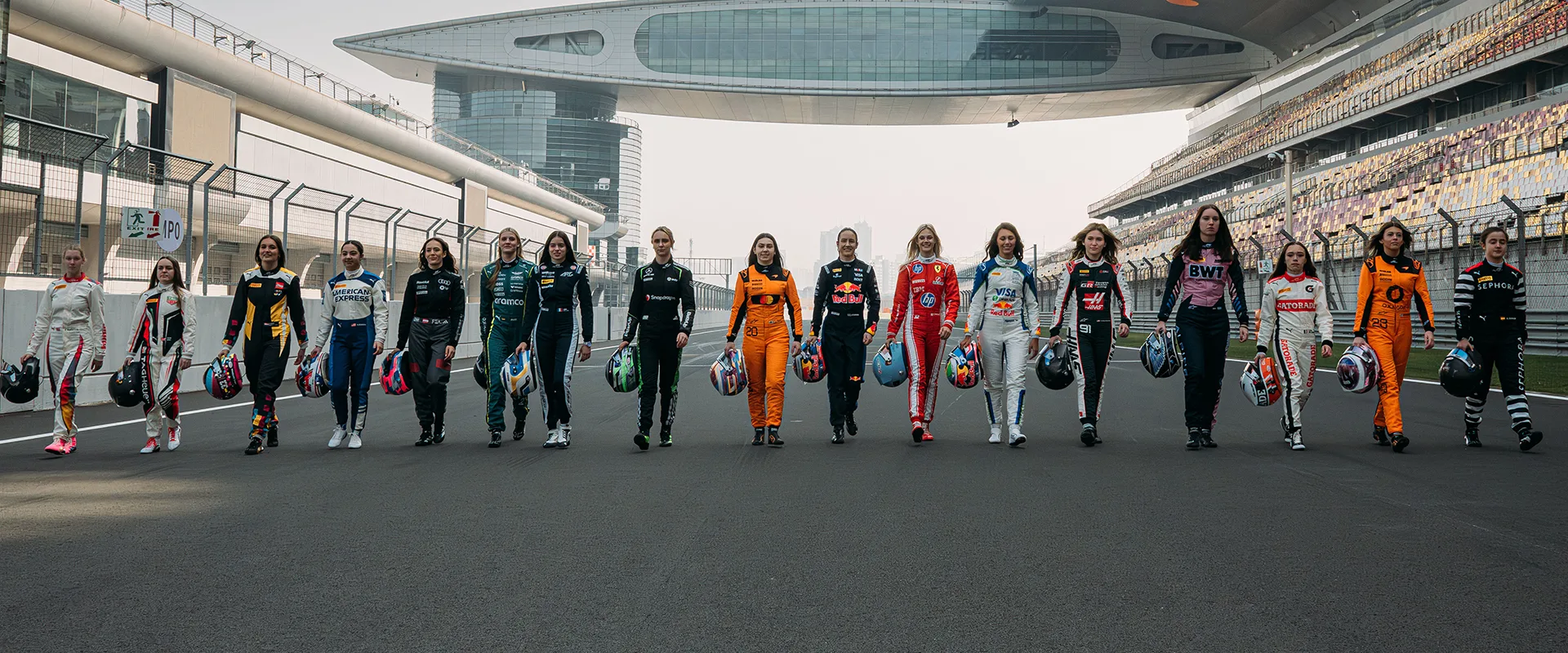 F1 ACADEMY drivers pose on the track.