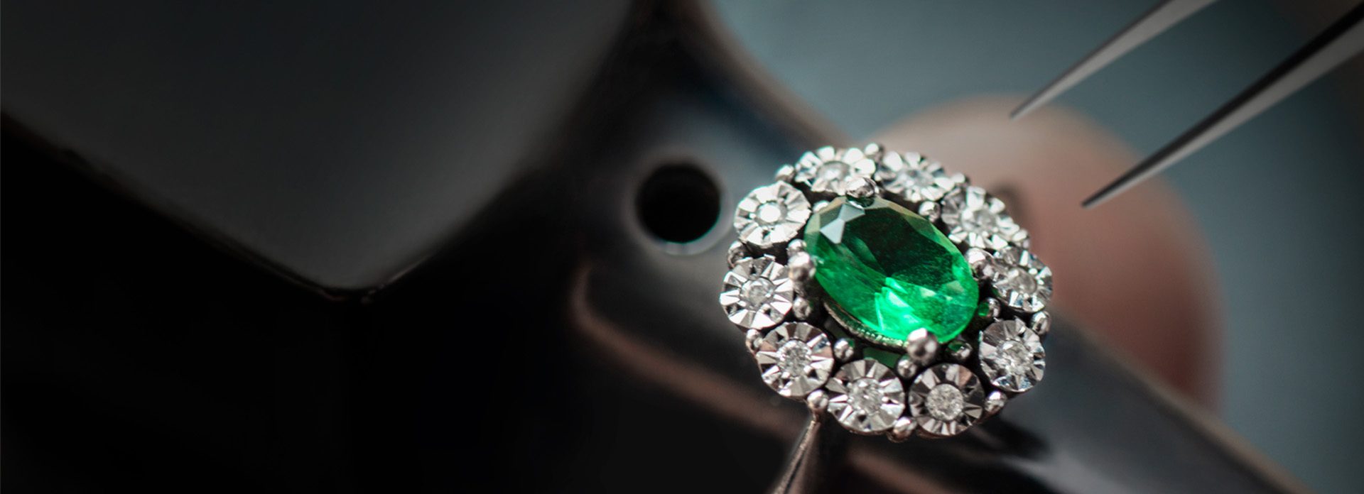 A ring with an emerald gemstone.