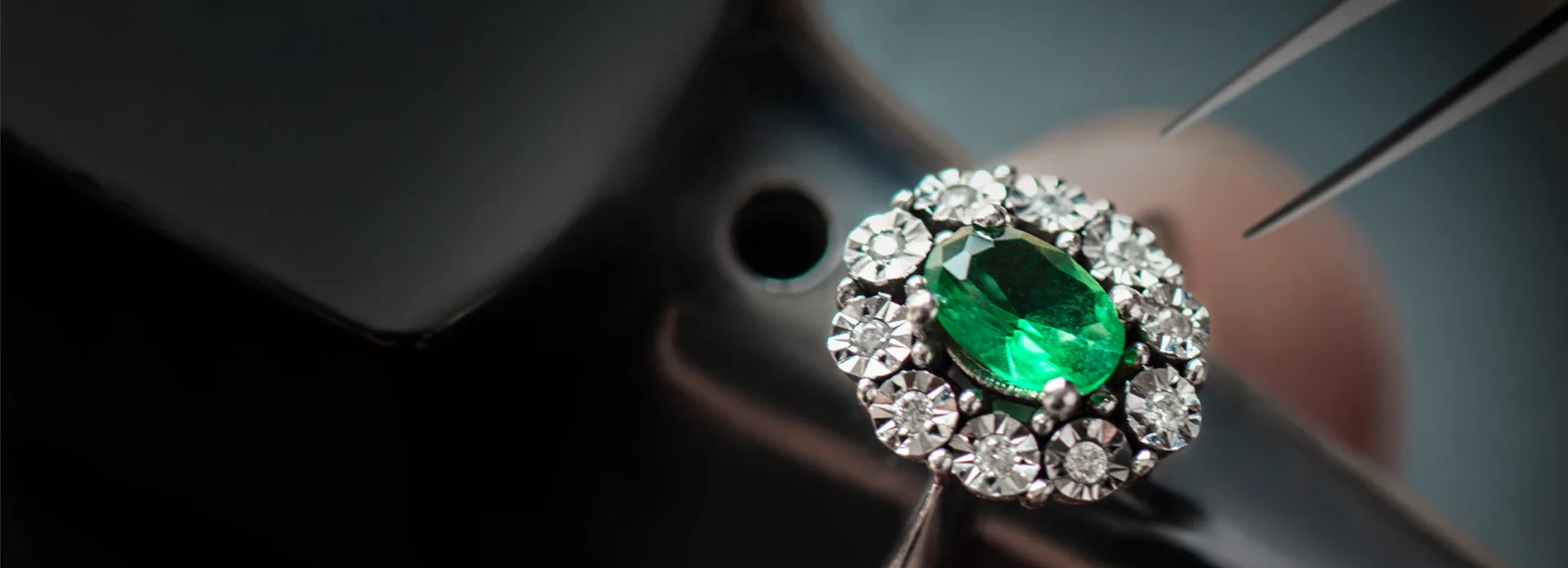 A ring with an emerald gemstone.
