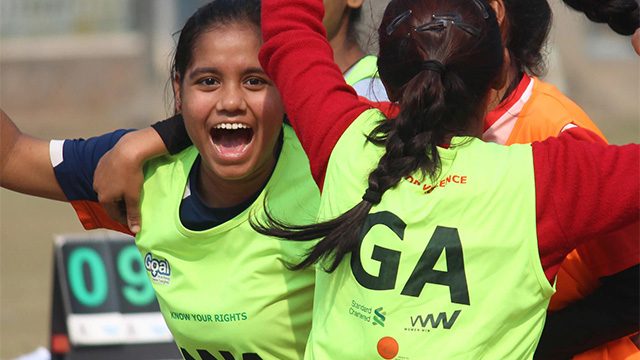 Girls cheering after scoring a goal