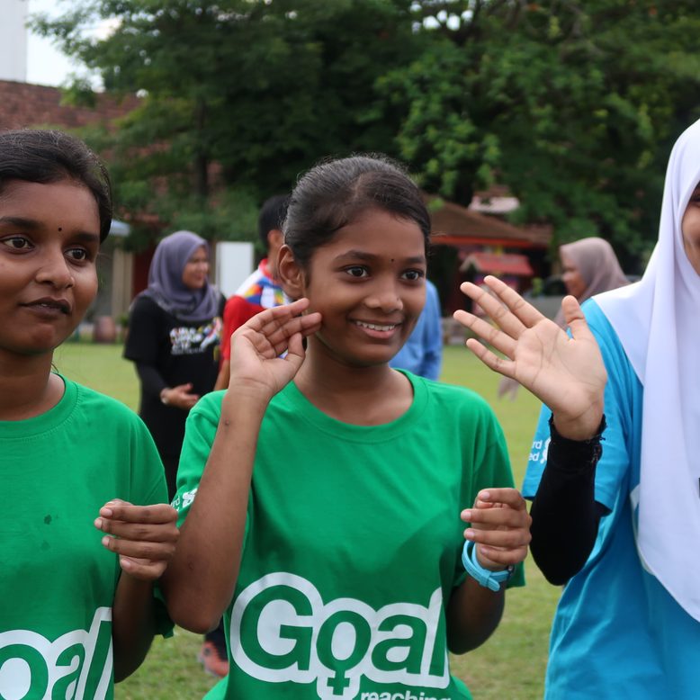 Three girls clapping