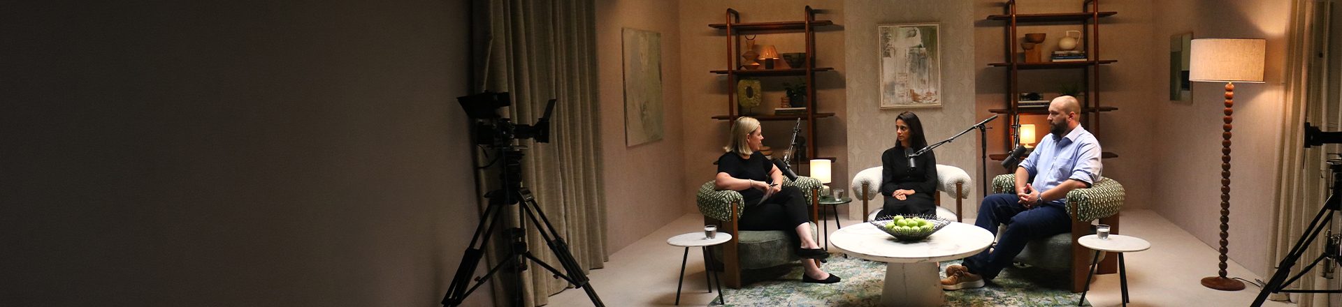 Behind the scenes picture of host in conversation with the guests at Studio session 4 shoot
