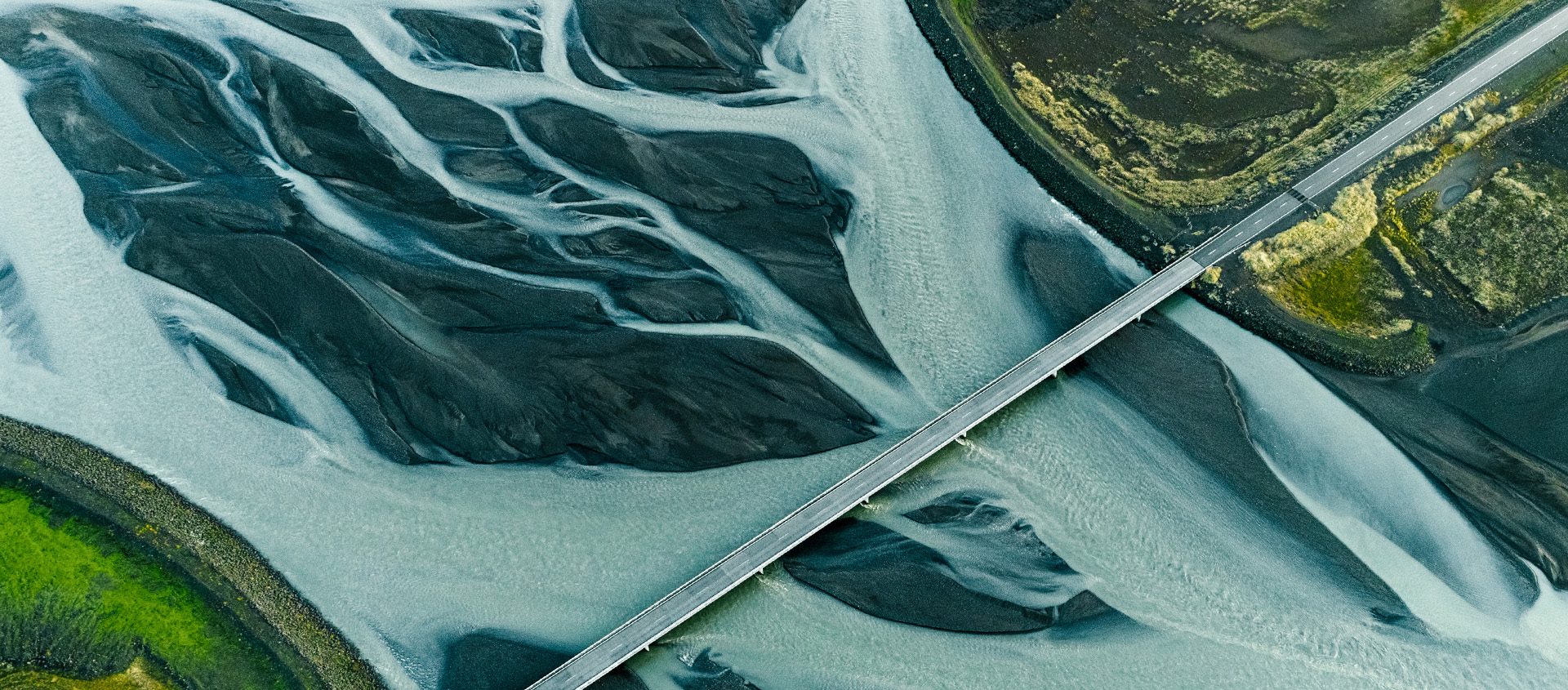 A bridge over a river with marbled water.