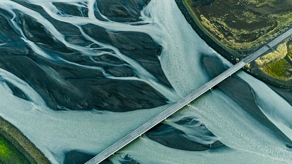 A bridge over a river with marbled water.