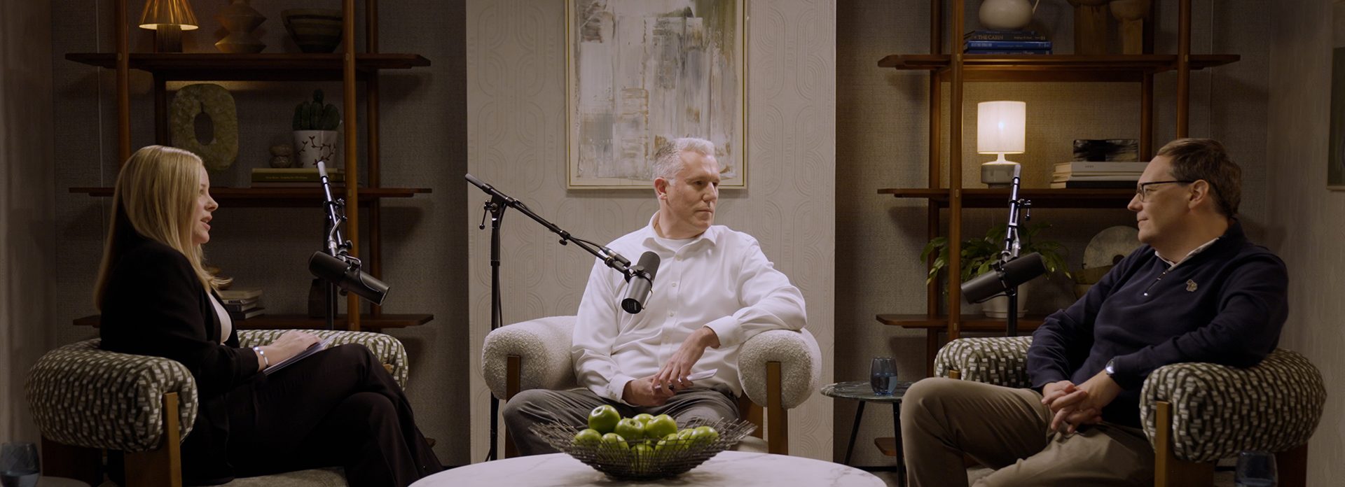 A podcast studio with two cyber security experts being interviewed.