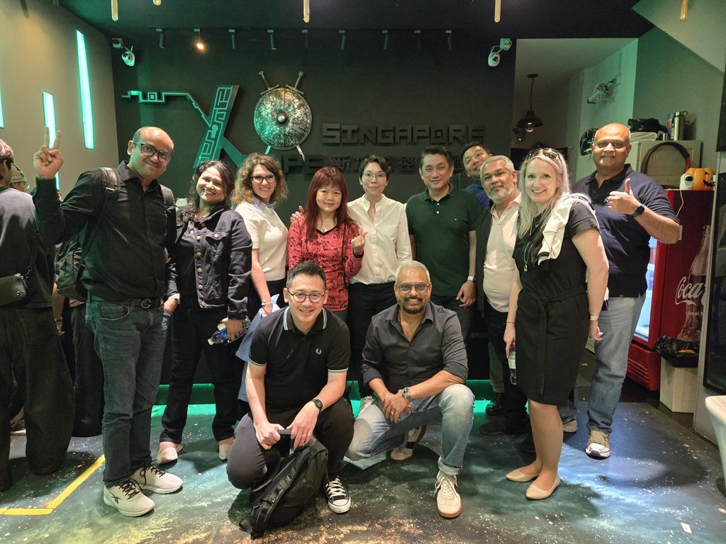 A group shot featuring Felicia Ong alongside her team.