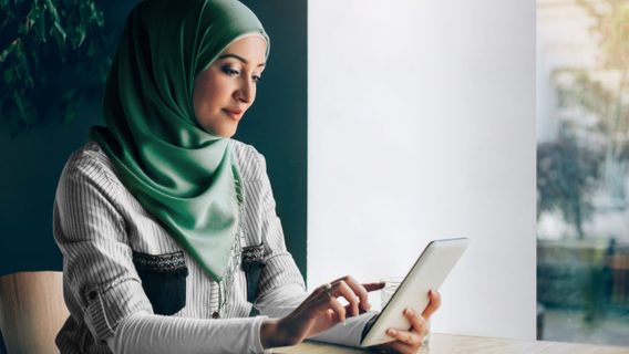 Affluent middle east woman with tablet