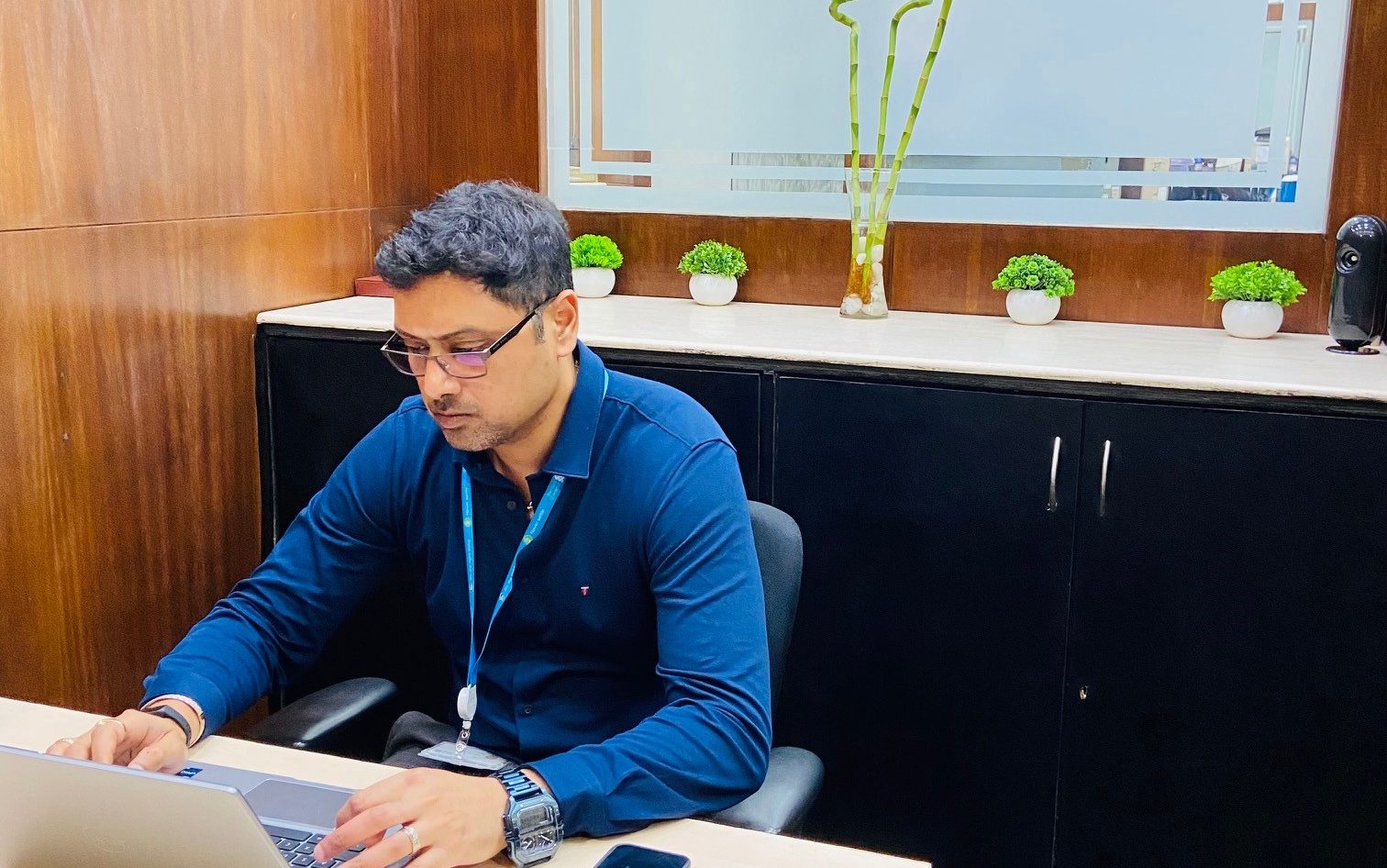 An employee working with his laptop