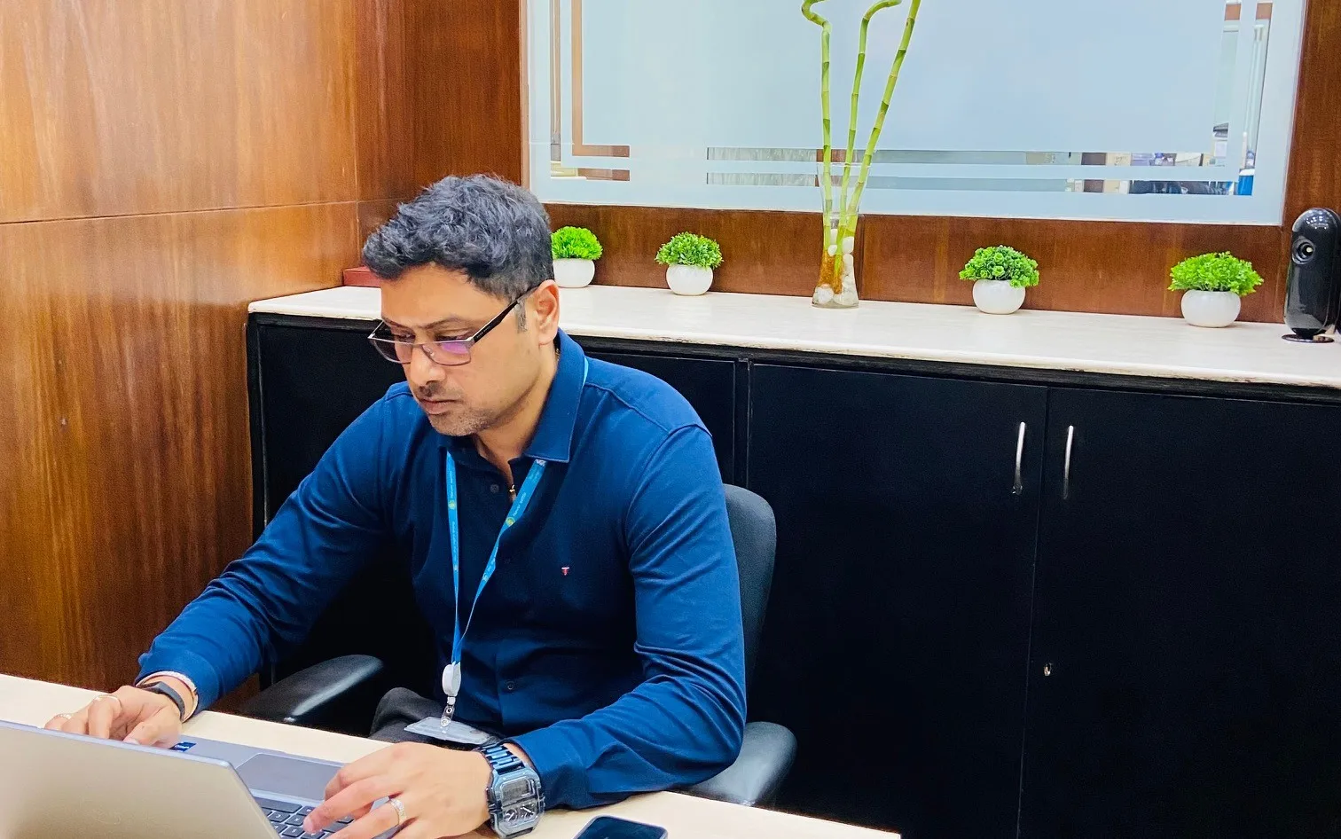 An employee working with his laptop