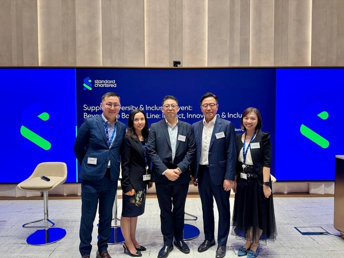 Employees take a photo with John Thang