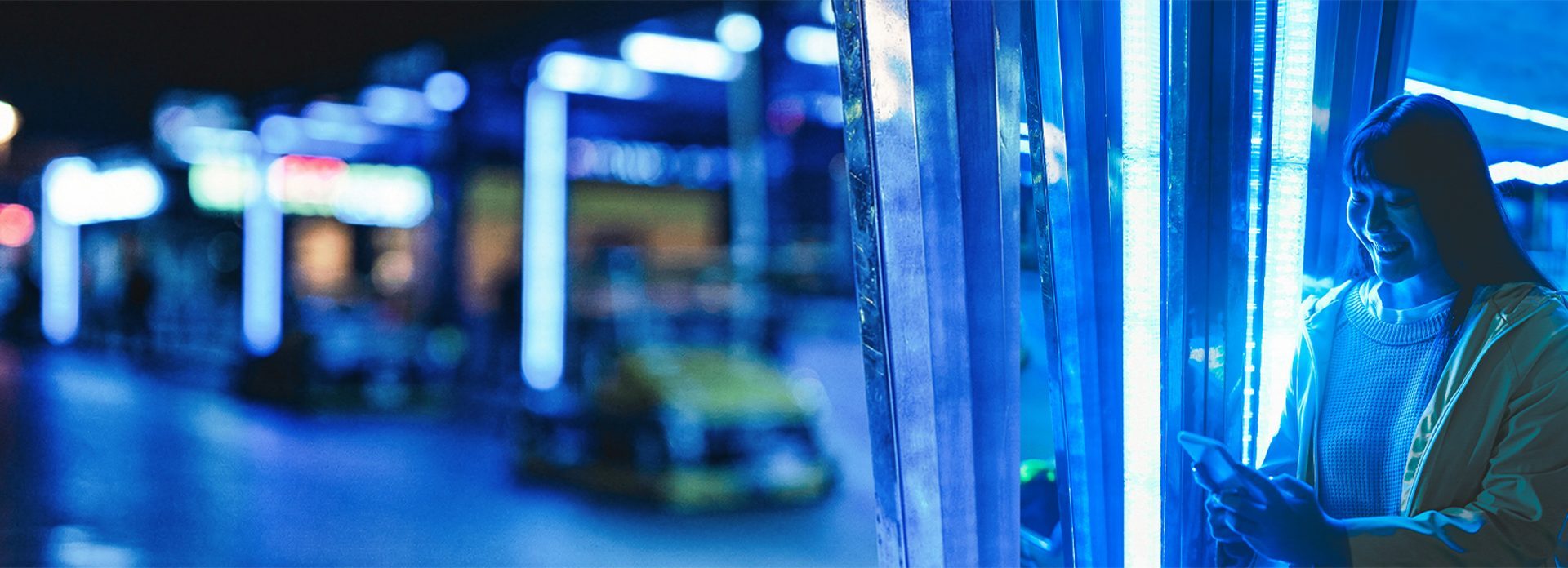 Young Asian woman looking at her mobile phone