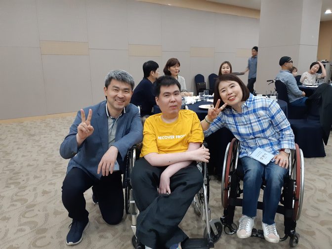 Group of people posing for a photograph at an event