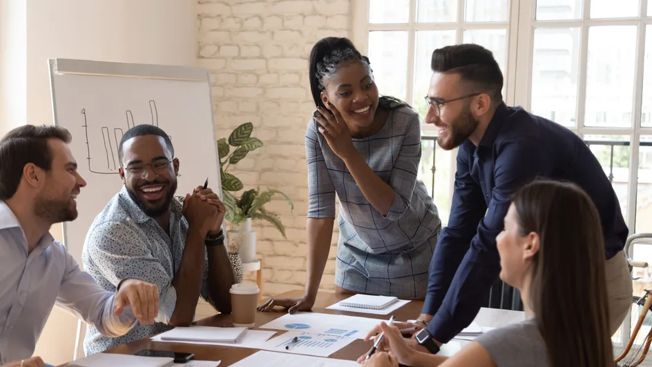 A group of employees discussing in office