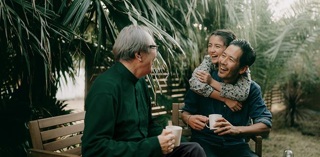 A family gather in a garden