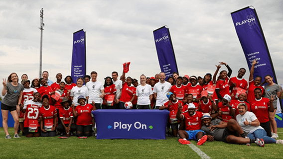 Participants in a Play On training session take a group photo to celebrate.