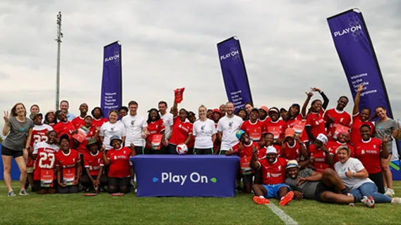 Participants in a Play On training session take a group photo to celebrate.