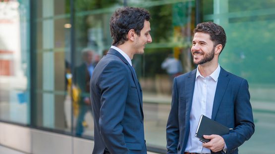Two men discussing business